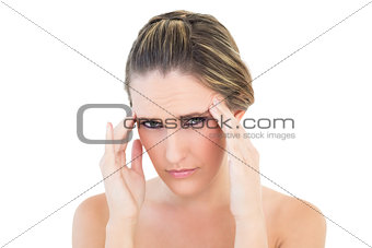 Portrait of upset woman with a headache