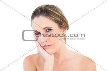 Upset woman looking at camera with a toothache