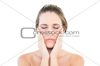 Woman hands on cheek eyes closed