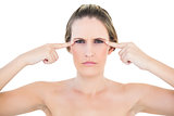 Angry woman pointing to eyes looking at camera