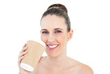Smiling woman holding coffee
