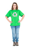 Serious woman wearing recycling tshirt posing