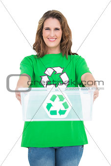 Smiling activist holding recycling box