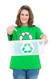 Woman holding recycling bin