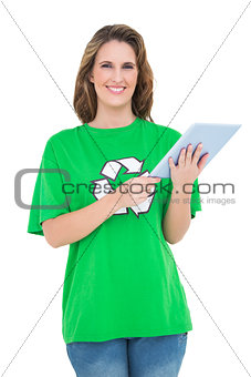 Smiling environmental activist using digital tablet