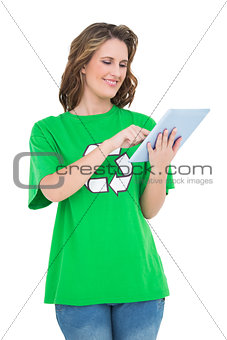 Smiling environmental activist using tablet