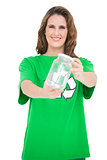 Smiling environmental activist holding glass