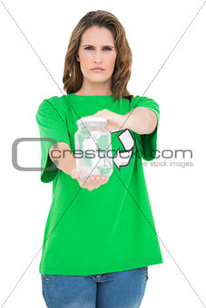 Serious environmental activist holding glass looking at camera