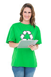 Smiling environmental activist holding clipboard