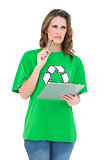 Pensive environmental activist holding clipboard