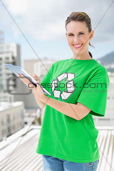Environmental activist wearing recycling tshirt using tablet