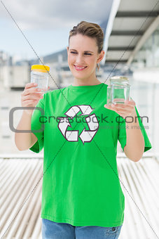 Cheerful activist holding glass pots