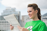 Environmental activist reading newspaper
