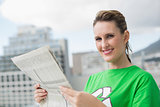 Environmental activist holding newspaper