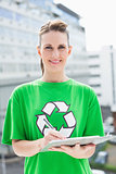 Happy environmental activist holding clipboard