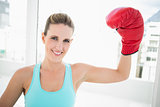 Woman rising her boxing glove up