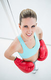 Fit woman wearing boxing gloves