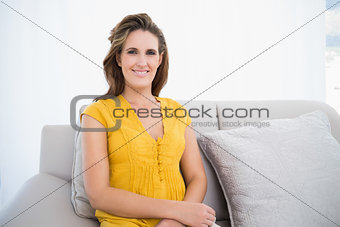 Peaceful woman sitting in living room