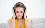 Peaceful woman wearing headphones