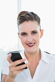 Close up view of businesswoman using smartphone