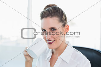 Close up view on businesswoman having coffee