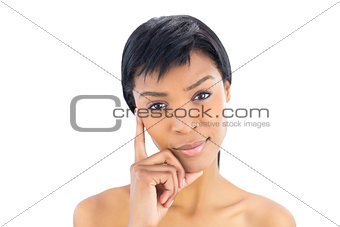 Wondering black haired woman posing looking at camera
