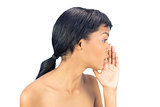 Attractive black haired woman whispering a secret