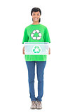Pleased black haired ecologist holding a recycling box