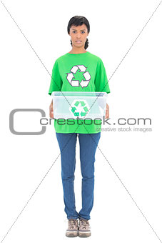 Irritated black haired ecologist holding a recycling box