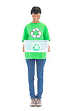 Content black haired ecologist holding a recycling box