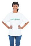 Content black haired volunteer posing with hands on the hips
