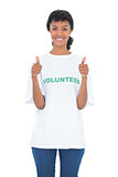 Charming black haired volunteer giving thumbs up