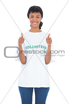 Charming black haired volunteer giving thumbs up