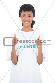 Cheerful black haired volunteer giving thumbs up