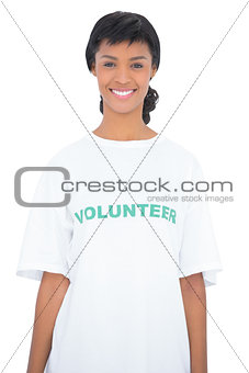 Content black haired volunteer posing looking at camera