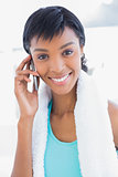 Gorgeous black haired woman calling someone with her mobile phone