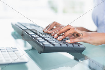 Close up of a businesswoman typing on a keyboard