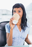 Calm businesswoman drinking coffee