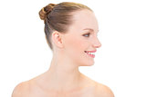 Profile view of a smiling pretty blonde model