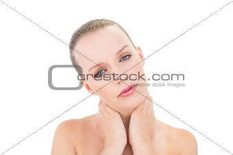 Pretty blonde model holding her sore neck