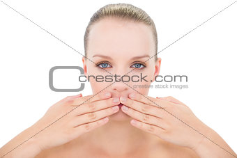 Natural pretty blonde model covering her mouth