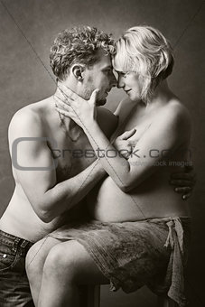 Loving happy couple, pregnant woman with her husband