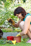 happy smiling middle age woman gardening