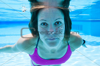 Woman underwater in pool