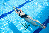 Female freediver diving in pool