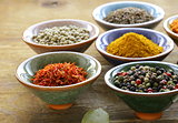 different kinds of spices in ceramic bowls