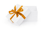 open white textured gift box with orange ribbon bow