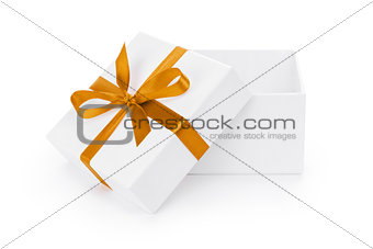 open white textured gift box with orange ribbon bow