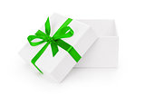 open white textured gift box with green ribbon bow