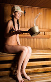 young woman relaxing in a sauna